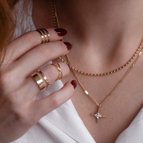 young-female-s-hands-with-golden-rings-and-manicur-2026-01-05-05-47-45-utc